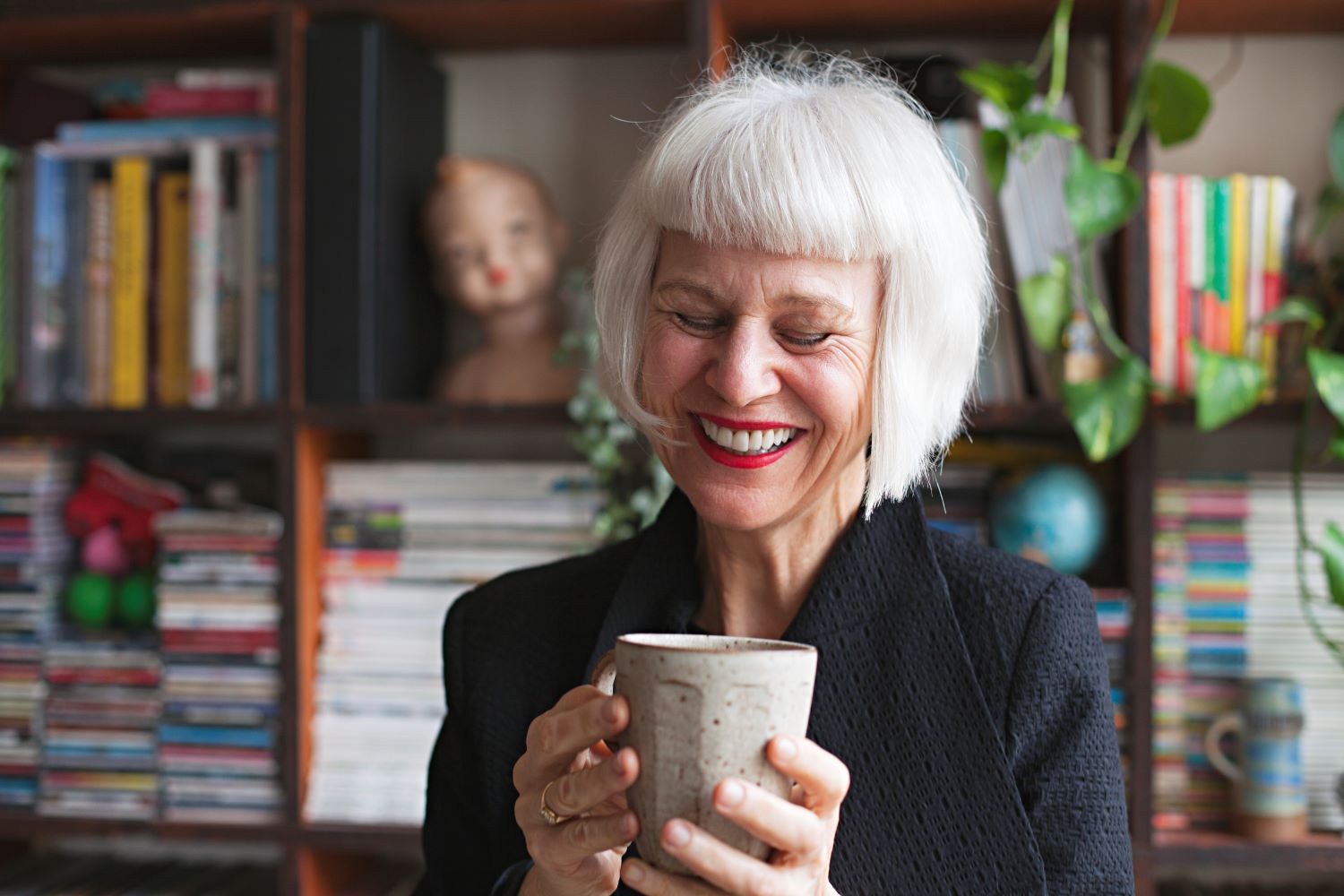 woman smiling with coffee mug